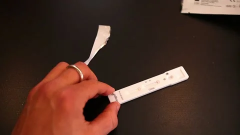 Opening a covid antigenic quick test kit, close up shot Video stock 171471002
