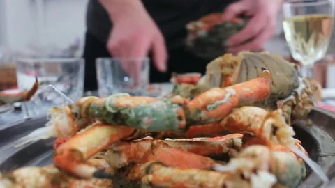 Opening crabs before eating them Video stock 239108664