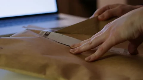 Opening craft packaging close-up. Eco. Delivery and online shopping concept. Stock Footage 170441315