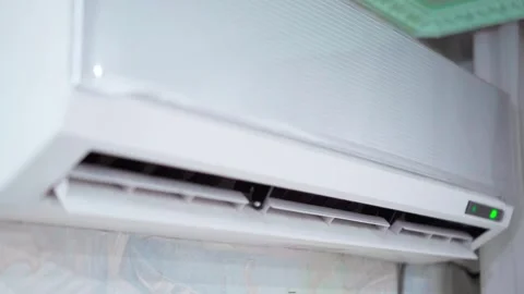 Opening the curtains of the air conditioner when turned on and closing when.. Stock Footage 247553380