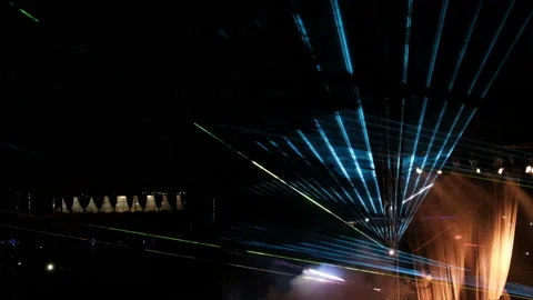 Opening the curtains on stage during a laser show on the street. Abstract multic Stock Footage 94871753