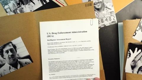 Opening DEA Case File Folder With Report About Pablo Escobar and Medellin Video stock 324393689
