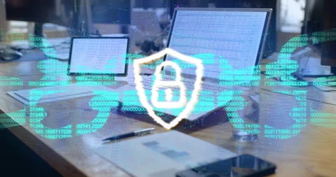 Opening desk showing devices with scrolling code forming sphere, pulsing shield Stock Footage 314686995