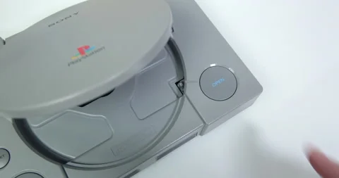 Opening the disk tray on a Sony Playstation games console 動画素材 161502299