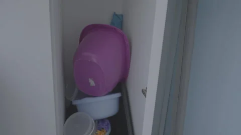 Opening door to flat storage room for cleaning supplies Stock Footage 257947070