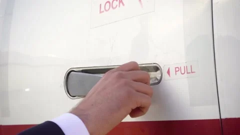Opening the door of the jet that is red and white Stock Footage 166725865