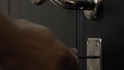 Opening the door lock with a key Stock Footage 78302620