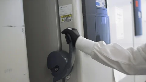 Opening the door of a nitrogen freezer Stock Footage 127532598