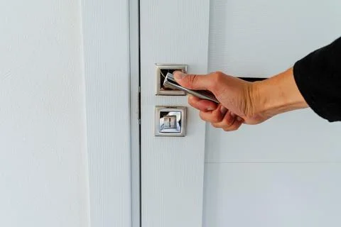 Opening the door in the room, hand opening the door by the handle, chrome d.. Stock Photos