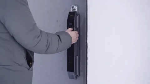 Opening a door with a smart lock by entering a code Stock Footage 328645523