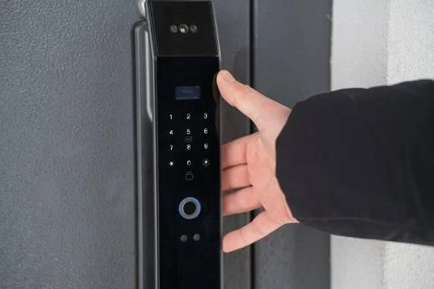 Opening the door with a smart lock Stock Photos