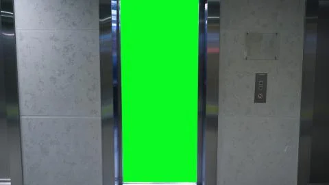 Opening doors in elevator with green screen. Elevator in office building Stock Photos