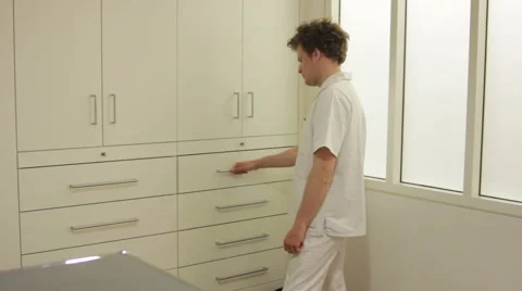 Opening drawer and shuffling through folders Stock Footage 41385162