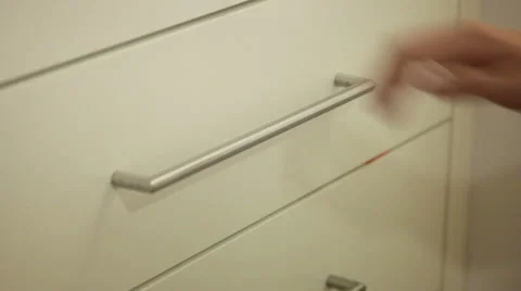 Opening drawer and shuffling through folders Stock Footage 41385307