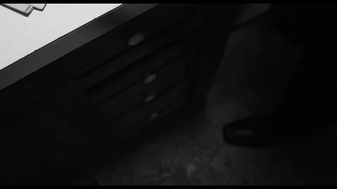 Opening drawer to reveal weapon. Stock Footage 90270833