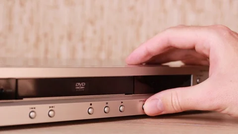 Opening DVD drive and inserting disc 動画素材 88245031