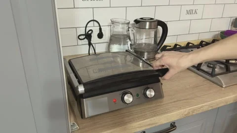 Opening Electric Waffle Maker At Home Kitchen Preparing Breakfast Waffles Video stock 336321790