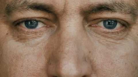 Opening eyes,Close-up of the man's face and eyes. portrait of a man. looking at Stock Footage 246877708