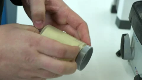 Opening of the flask. Stock Footage 183953418