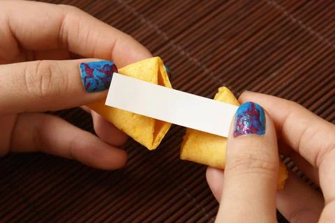 Opening A Fortune Cookie Foto stock