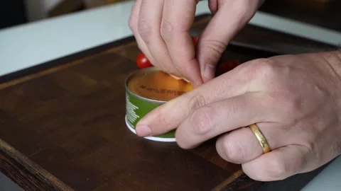 Opening a Fragrant Canned Fish Aromatic Delight Stock-Footage 303348542