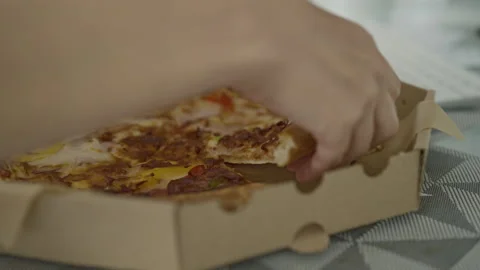 Opening a Fresh Pizza Box on a Gray Tablecloth Stock Footage 277245229
