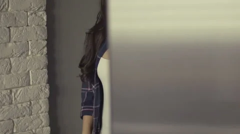 Opening the fridge door and choosing a healthy snack. In this case the hand Stock Footage 66369028
