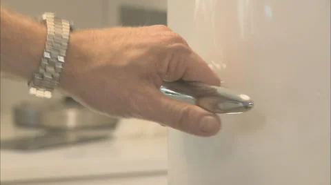 Opening fridge door in the kitchen, shallow depth of field Stock Footage 39585121