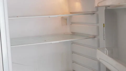Opening the fridge, an empty and dirty fridge. Poverty, food crisis. An element Stock Footage 230929759