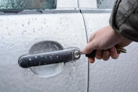 Opening frozen car lock with key Stock Photos