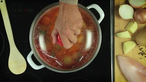 Opening The Glass Lid of the Kitchen Pot With Boiling Vegetables. Stock Footage 165701609