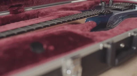 Opening guitar case with beautiful blue electric guitar Stock Footage 64622146