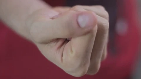 Opening hand revealing 2 cloves of garlic and closing hand again Stock Footage 75584702