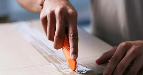Opening, hands and man with box cutter in home for ecommerce package, couri.. Stock Photos