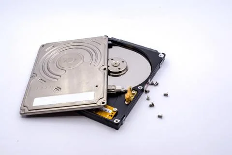 Opening of hard disk for data recovery Isolated on white background. Dismantl Stock Photos