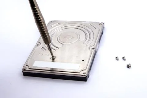 Opening of hard disk for data recovery Isolated on white background. Dismantl Stock Photos