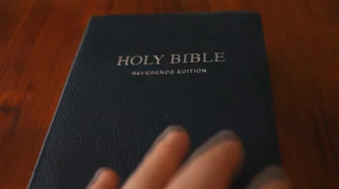 Opening the Holy Bible Stock Footage