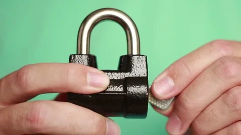 Opening iron lock with a key Stock Footage 76691042