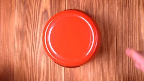 Opening a jar of red caviar close up Stock Footage 122309377