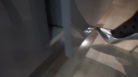 Opening the kitchen cabinet with a foot movement Stock Footage 229843830