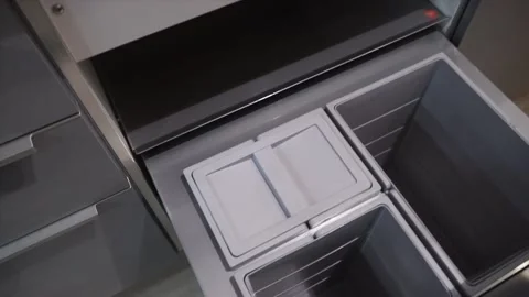 Opening the kitchen cabinet with a foot movement	 Stock Footage 229844895