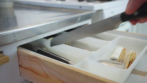 Opening Kitchen Drawer and Taking Out Bread Knife Stock Footage 328011781