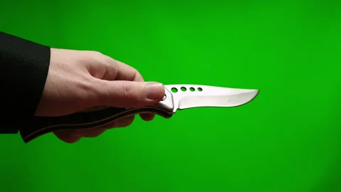 Opening a knife on a green background 库存影片 152093194