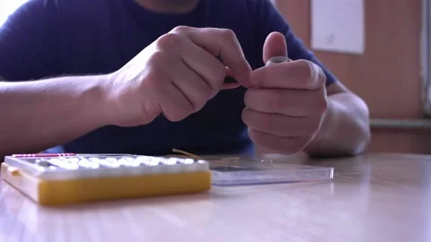 Opening up lamp receptacle with a screwdriver. Stock Footage 229269594