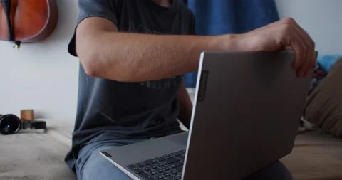 Opening Up Laptop Computer On Bed Stock Footage 141554123