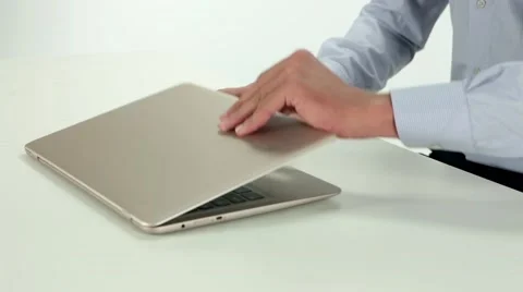 Opening a laptop Stock Footage 67857338