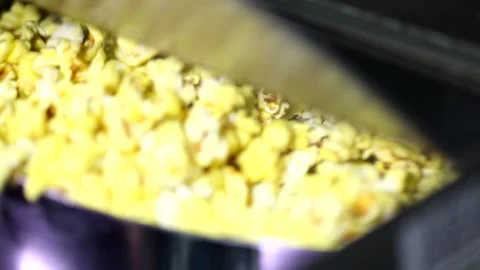 Opening lid of automatic rotating popcorn making machine full cheese caramel swe Stock Footage 137541599