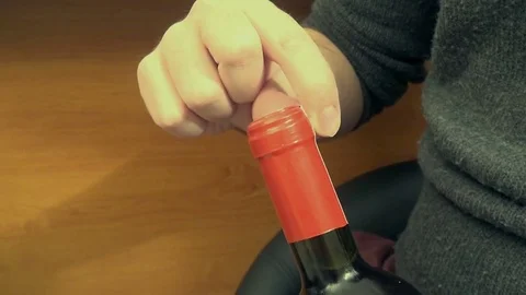 Opening the Lid of a Bottle of Wine Stock Footage 74281092