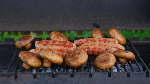 Opening the lid of grill to check champignon and sausages on grid Stock Footage 250444165