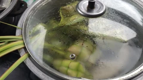 Opening Lid of Pot Boiling Ketupat Rice Dumplings Vídeos de archivo 331982129